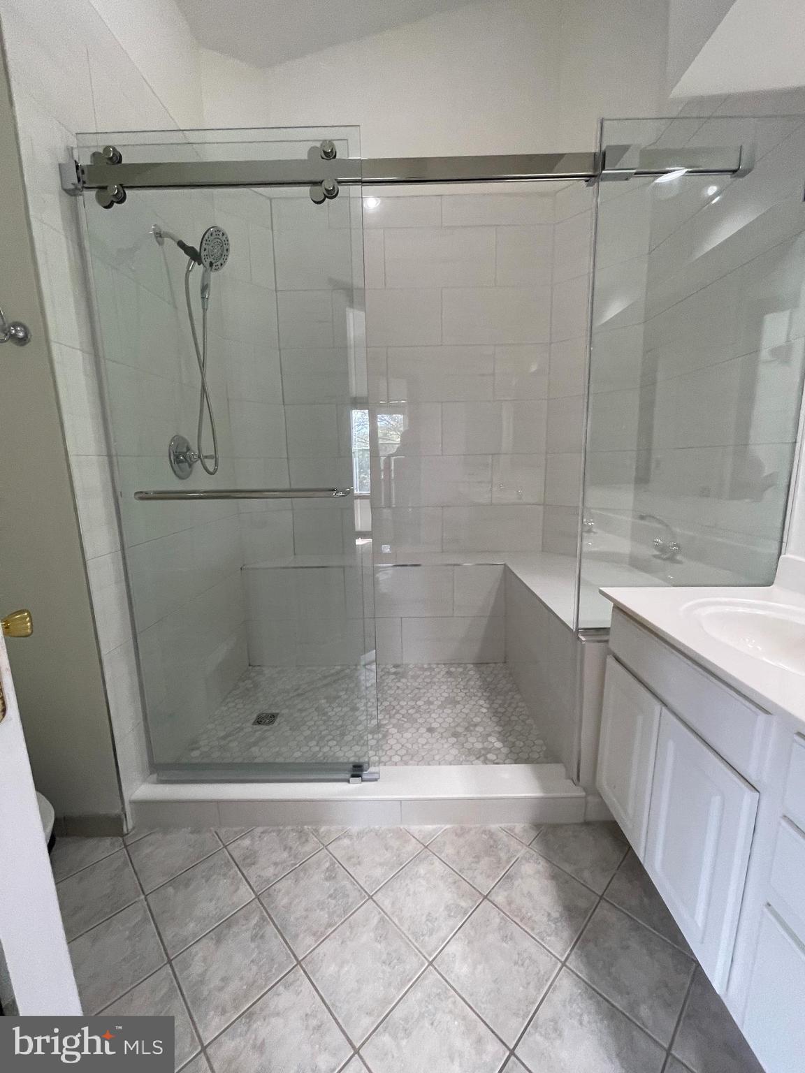 13701 Modrad Way, Unit 9C34 Silver Spring, MD 20904 - Photo 15 of 26 a bathroom with a shower and a sink