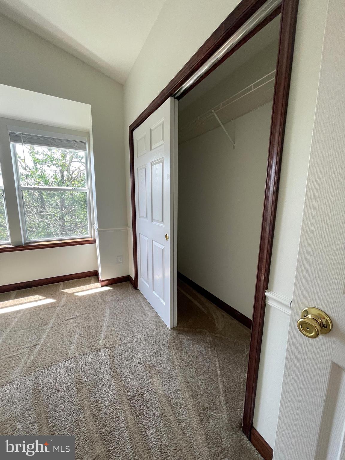 13701 Modrad Way, Unit 9C34 Silver Spring, MD 20904 - Photo 23 of 26 an empty room with windows