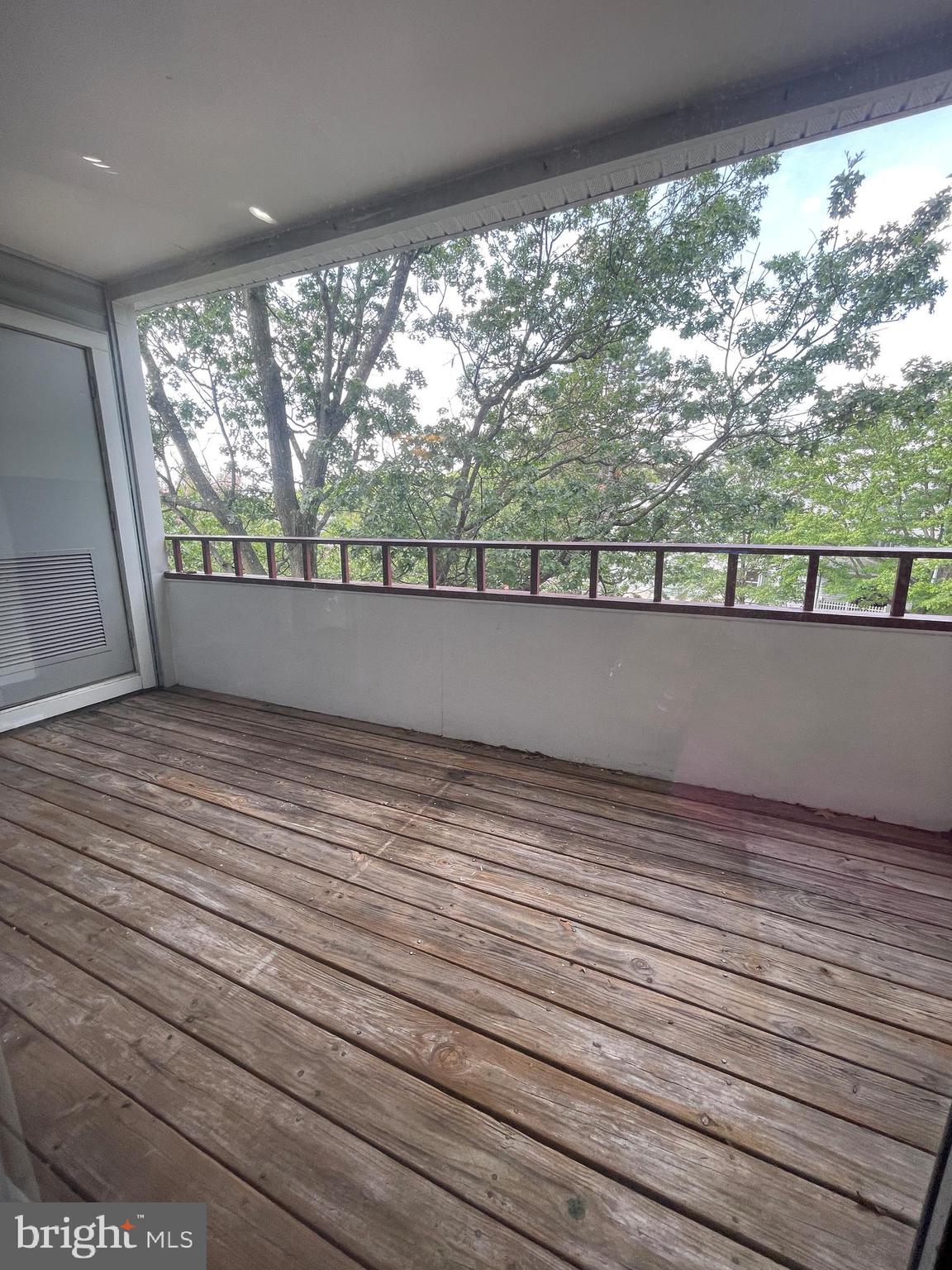 13701 Modrad Way, Unit 9C34 Silver Spring, MD 20904 - Photo 26 of 26 a view of empty room with large windows