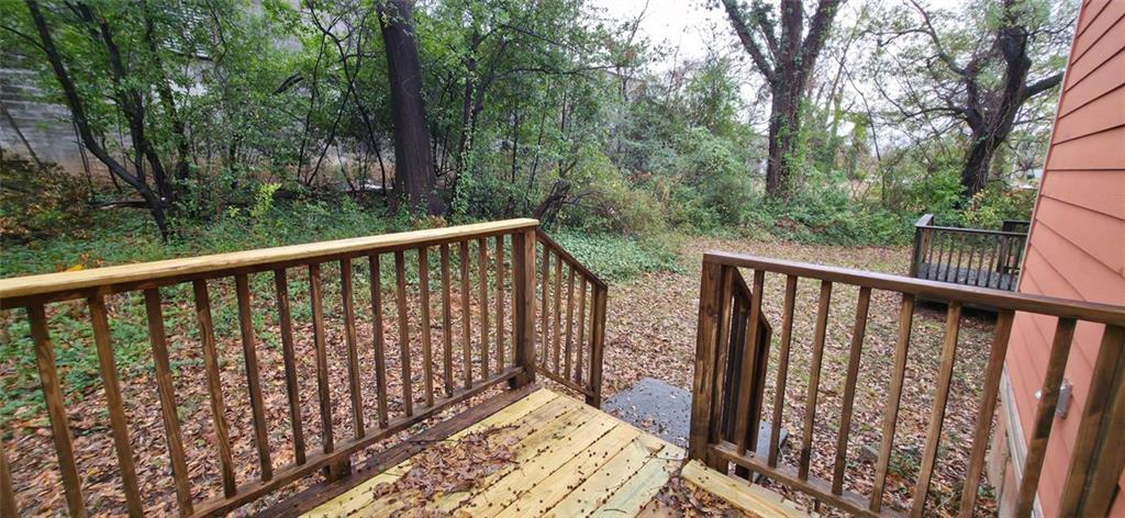 162 Walnut Street Southwest Atlanta, GA 30314 - Photo 18 of 18 a view of a balcony with wooden floor and fence