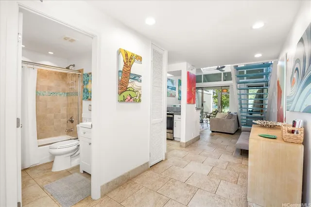 a bathroom with a toilet sink and shower