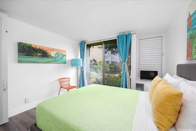 a bedroom with a bed and a chair