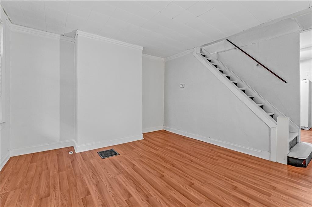 16 Spring Street Etna, PA 15223 - Photo 4 of 21 a view of empty room with wooden floor