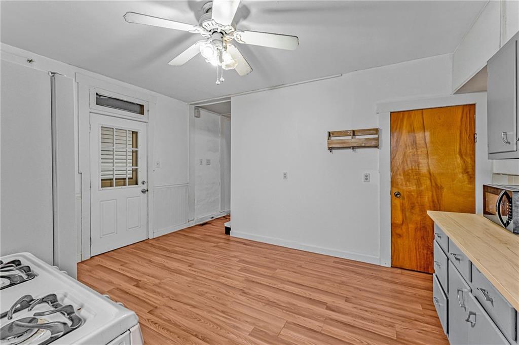 16 Spring Street Etna, PA 15223 - Photo 10 of 21 a bedroom with a bed and wooden floor