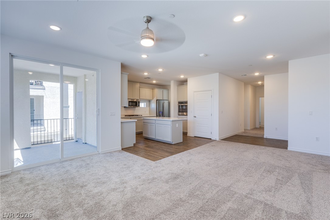 2555 Hampton Road, Unit 8206 Henderson, NV 89052 - Photo 25 of 25 An open floorplan seamlessly connects the kitchen and living areas, offering effortless transitions to the outdoor balcony.