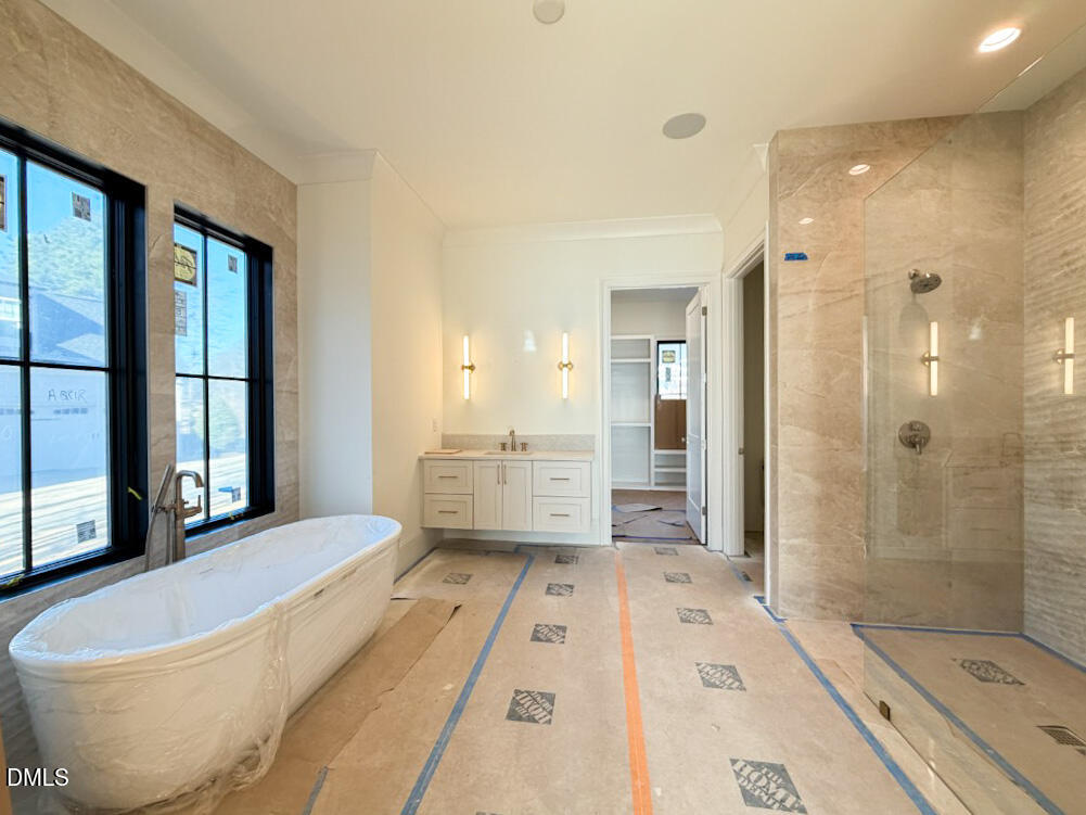 1513 Rock Dove Way Raleigh, NC 27614 - Photo 12 of 38 a spacious bathroom with a bathtub and shower