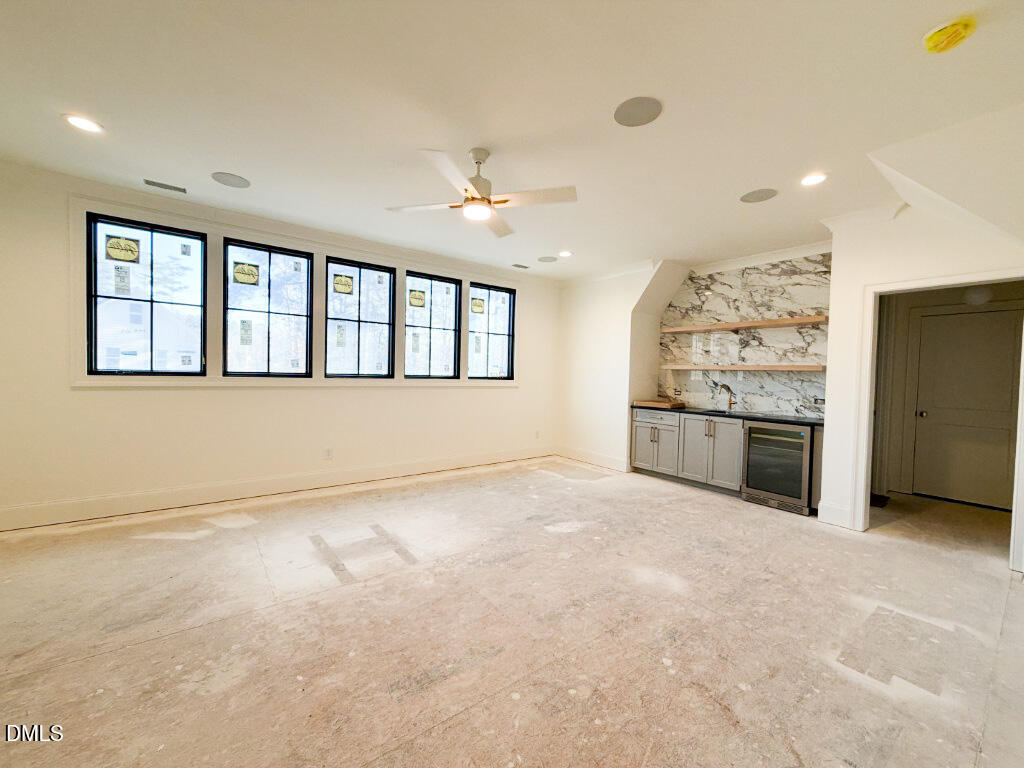 1513 Rock Dove Way Raleigh, NC 27614 - Photo 24 of 38 an empty room with windows and fireplace