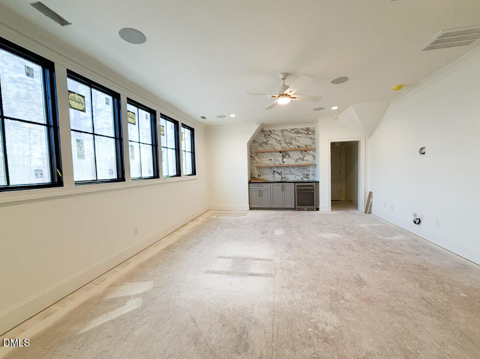1513 Rock Dove Way Raleigh, NC 27614 - Photo 25 of 38 a view of an empty room with a kitchen