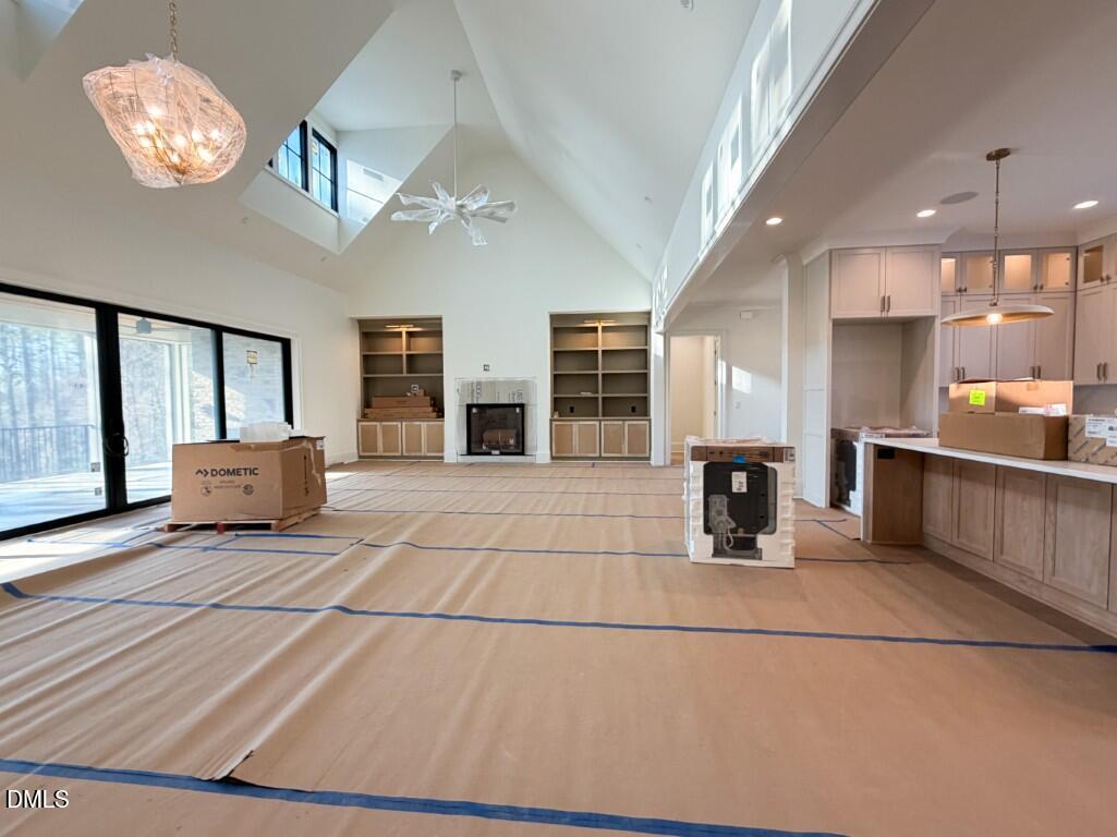 1513 Rock Dove Way Raleigh, NC 27614 - Photo 7 of 38 a lobby with furniture and a chandelier