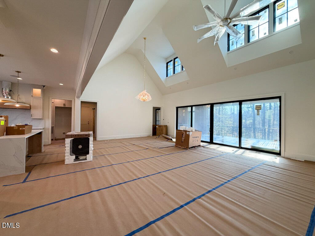 1513 Rock Dove Way Raleigh, NC 27614 - Photo 8 of 38 a view of empty room with wooden floor and fireplace