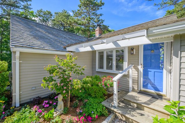a front view of a house with a porch