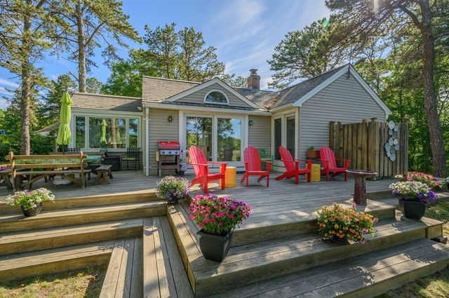 a view of a house with patio outdoor seating