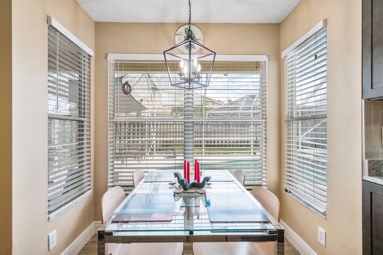 7250 Davit Circle Lake Worth, FL 33467 - Photo 13 of 35 a view of dining room and windows
