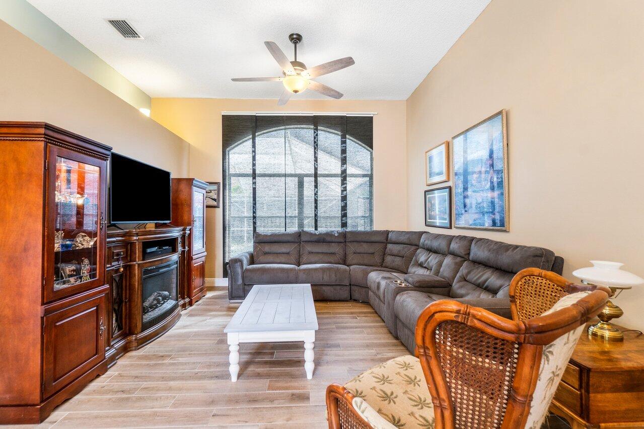7250 Davit Circle Lake Worth, FL 33467 - Photo 6 of 35 a living room with fireplace furniture and a flat screen tv