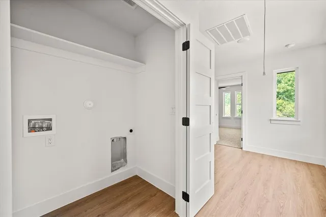 a view of entryway with wooden floor