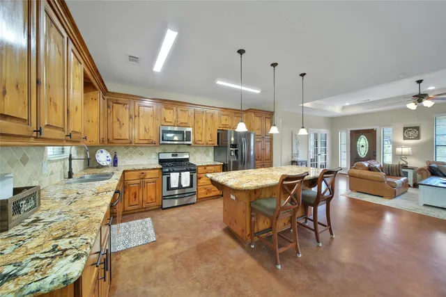 a view of a livingroom with furniture and window