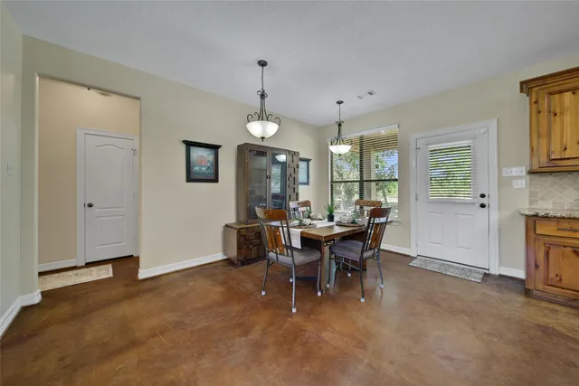 a large bathroom with a large tub and sink