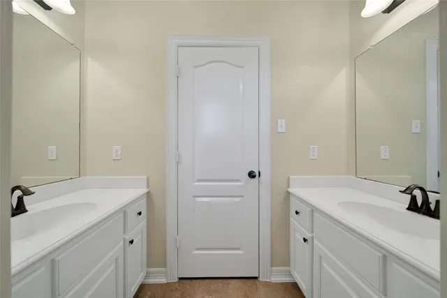 a utility room with sink dryer and washer