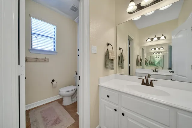a view of a porch with a table and chairs