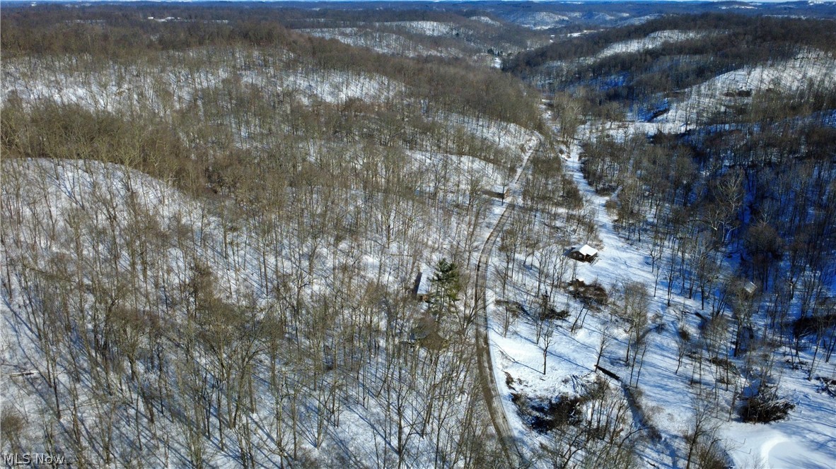 965 Back Run Road Philo, OH 43771 - Photo 2 of 3 Snowy aerial view featuring a mountain view