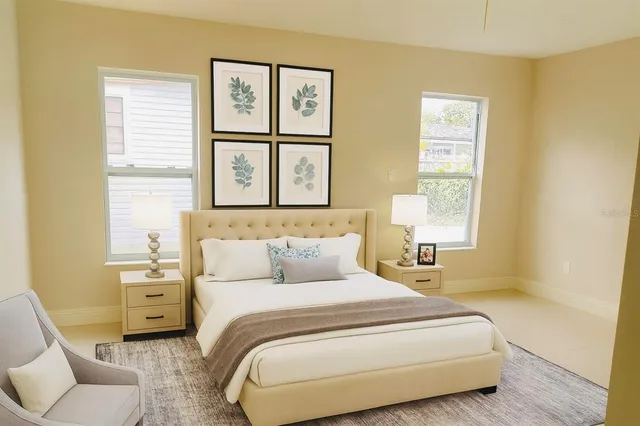 a bedroom with a bed and a couch