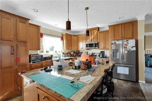 a kitchen with lots of counter top space and a window