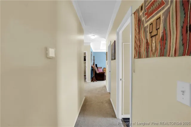 a living room with furniture and a mirror