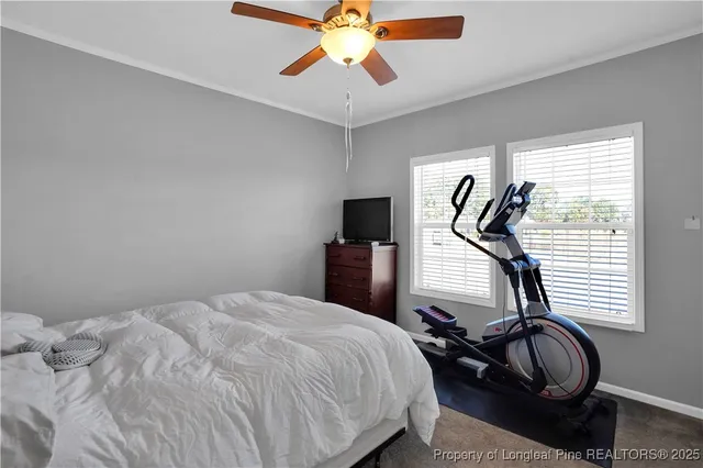 a bedroom with bed and a window