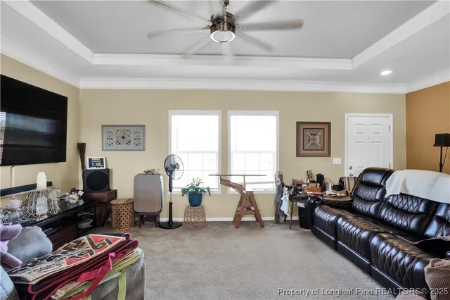 a kitchen with stainless steel appliances a refrigerator a sink a stove and white cabinets