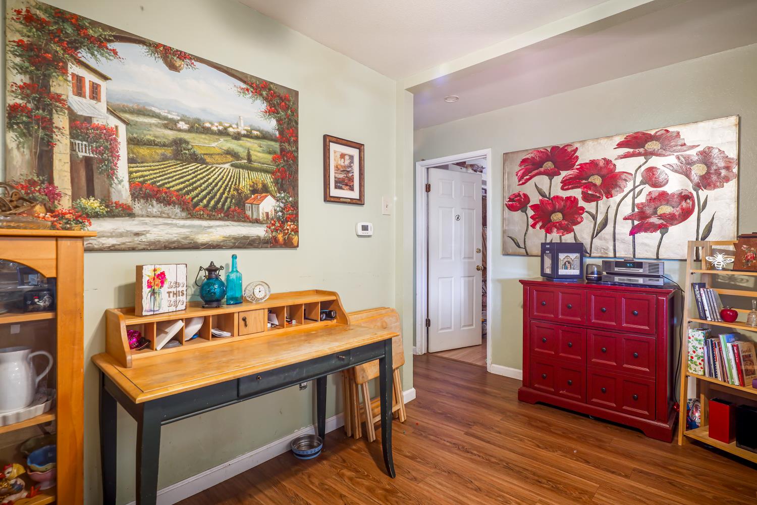 23404 Bruella Road Acampo, CA 95220 - Photo 40 of 69 a room with furniture and wooden floor