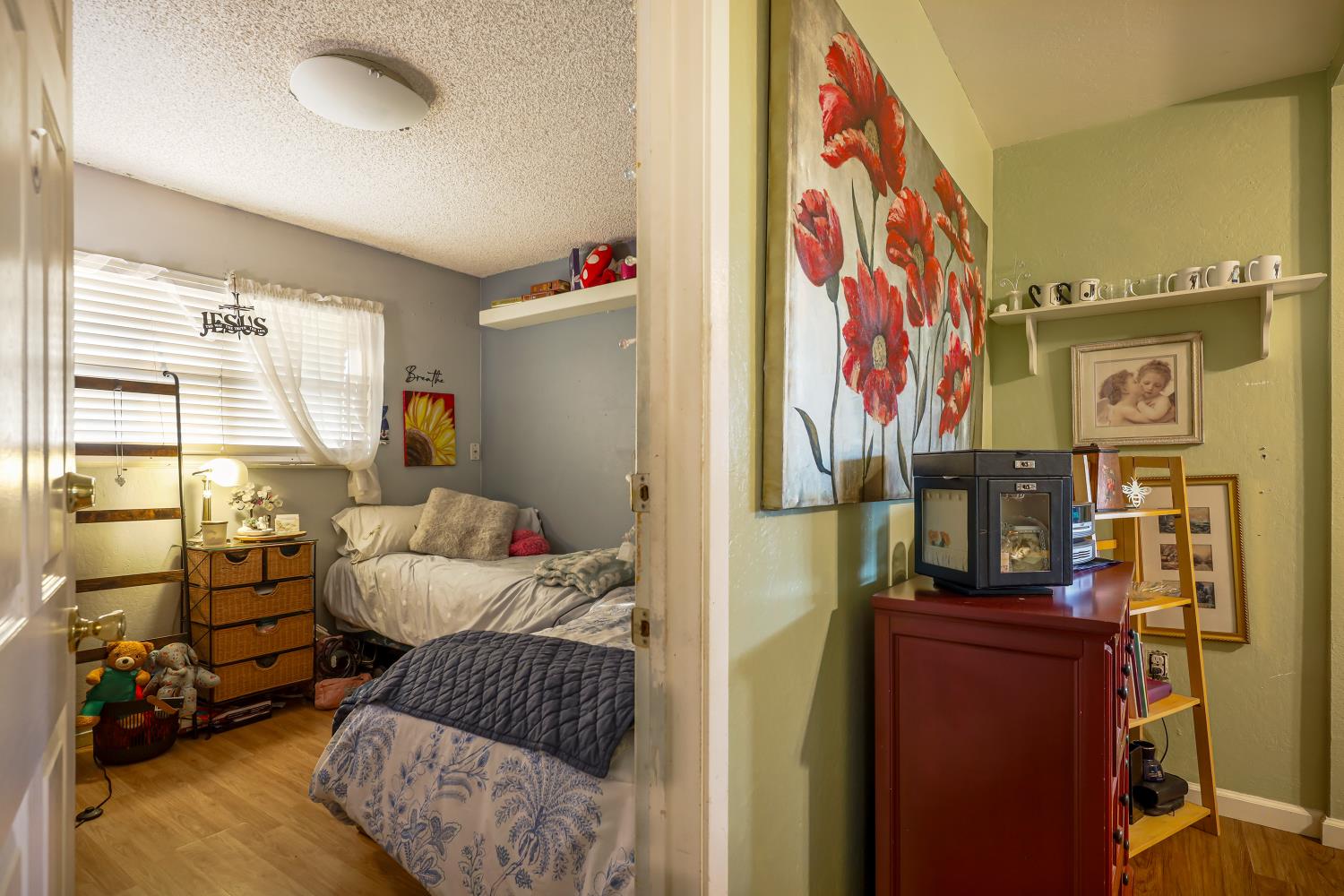 23404 Bruella Road Acampo, CA 95220 - Photo 41 of 69 a bedroom with furniture and a window