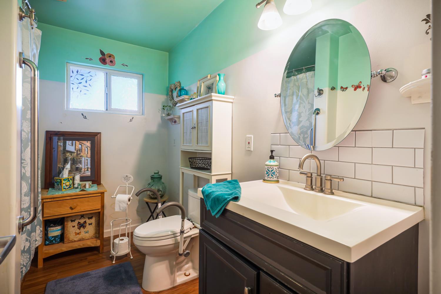 23404 Bruella Road Acampo, CA 95220 - Photo 43 of 69 a bathroom with a sink a toilet and shower