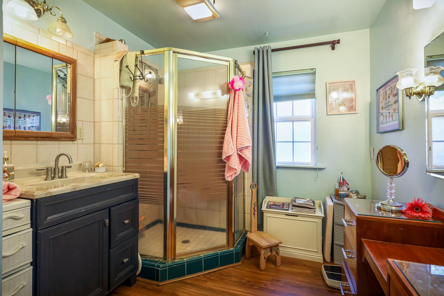 23404 Bruella Road Acampo, CA 95220 - Photo 44 of 69 a bathroom with a granite countertop sink mirror vanity and toilet