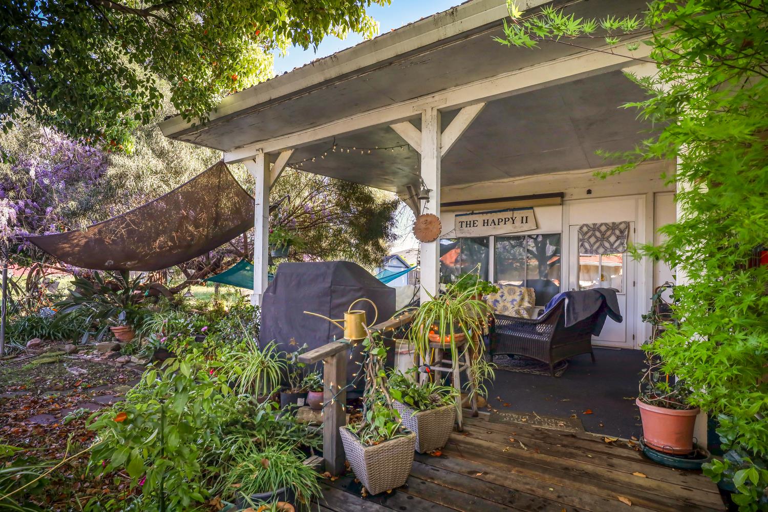 23404 Bruella Road Acampo, CA 95220 - Photo 51 of 69 a view of a patio with chairs and potted plants