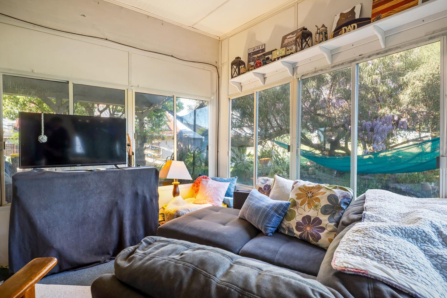 23404 Bruella Road Acampo, CA 95220 - Photo 54 of 69 a living room with furniture and a flat screen tv