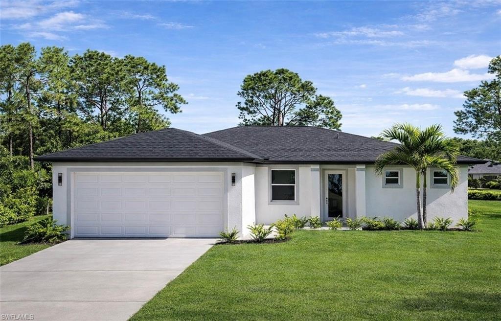 4113 19th Street Southwest Lehigh Acres, FL 33976 - Photo 1 of 3 front view of house with a yard