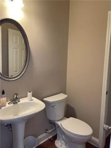 a kitchen with stainless steel appliances granite countertop wooden cabinets a stove top oven a sink and dishwasher