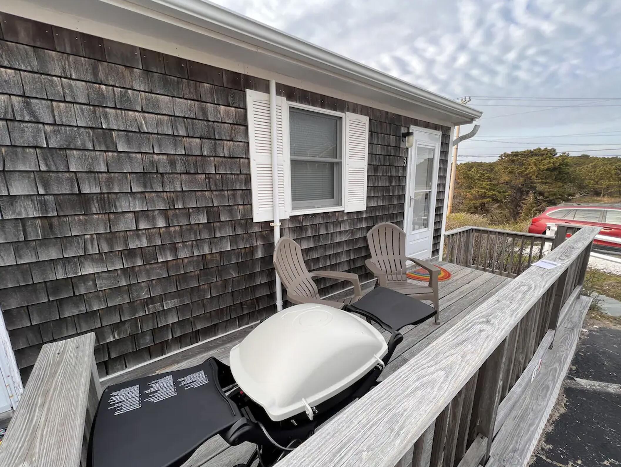 168 Shore Road, Unit 3 Truro, MA 02666 - Photo 1 of 14 a view of balcony with wooden floor and seating space