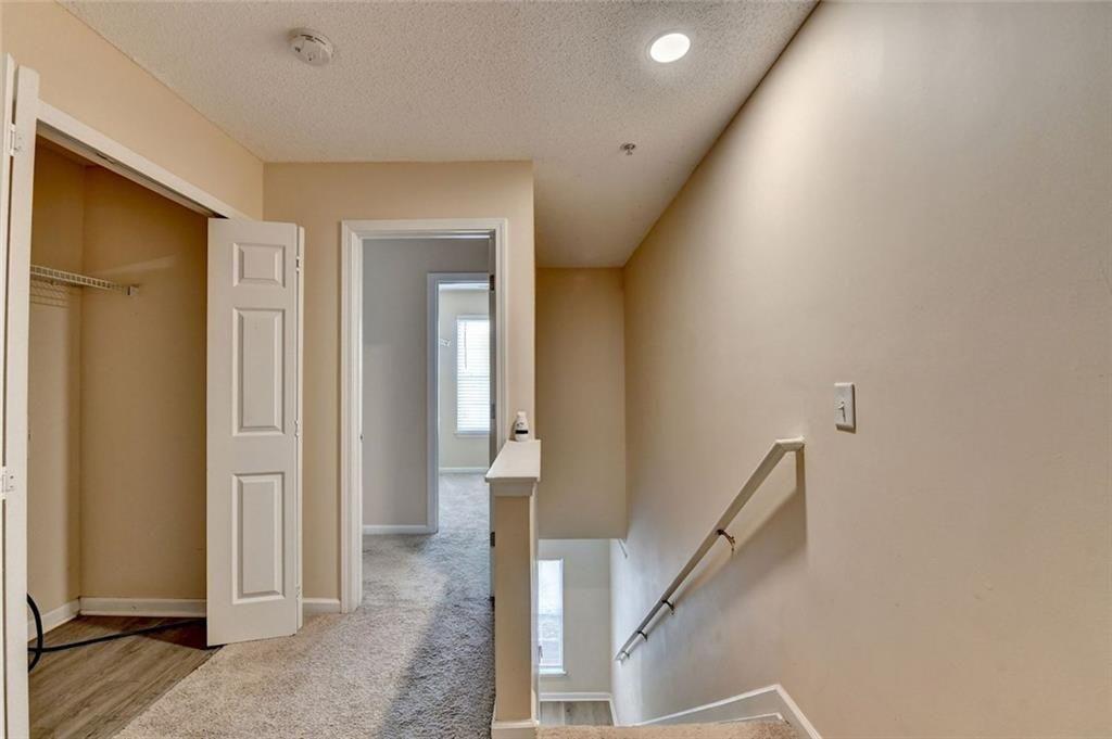 310 Azalea Circle Cumming, GA 30040 - Photo 16 of 38 a view of a hallway with a livingroom and stairs