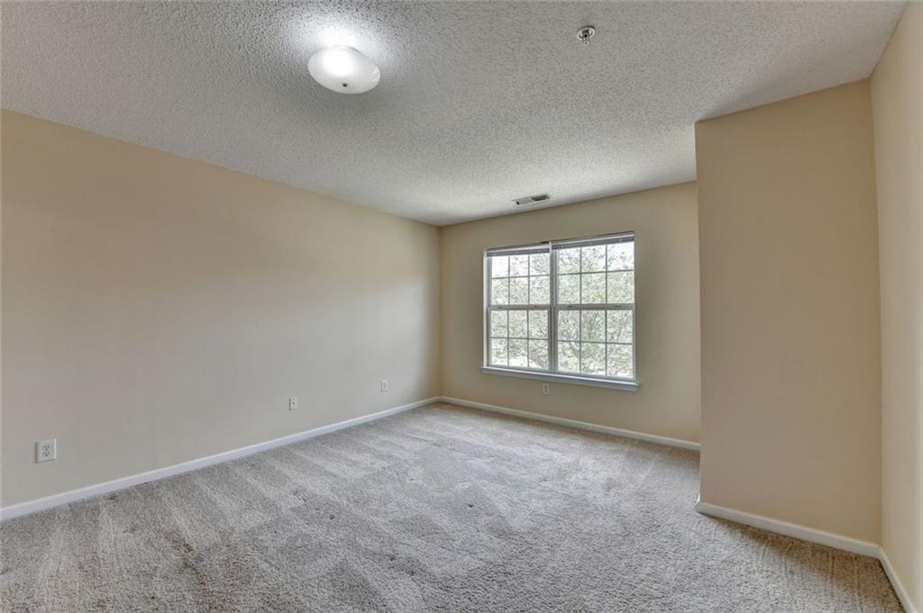 310 Azalea Circle Cumming, GA 30040 - Photo 18 of 38 a view of an empty room with a window