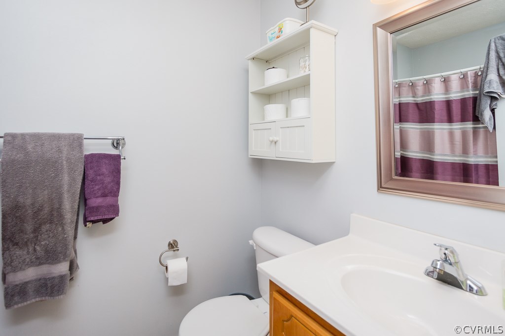 2612 Iverson Road Midlothian, VA 23112 - Photo 12 of 23 a bathroom with a sink toilet and shower