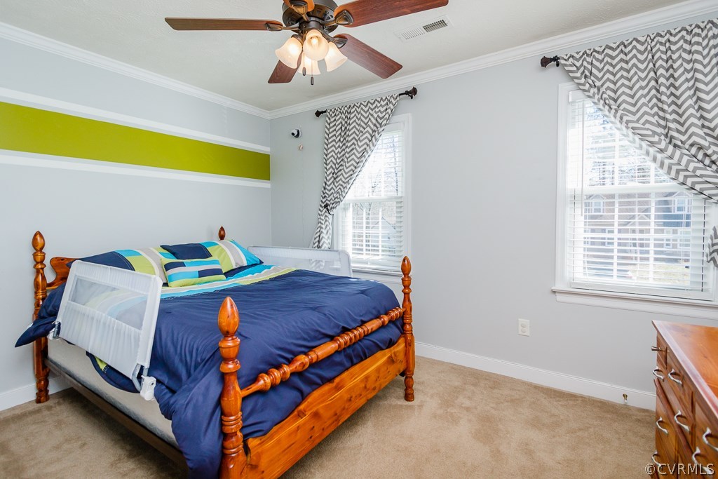 2612 Iverson Road Midlothian, VA 23112 - Photo 14 of 23 a bedroom with a bed and a chandelier