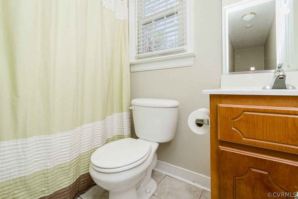2612 Iverson Road Midlothian, VA 23112 - Photo 17 of 23 a bathroom with a toilet and a sink