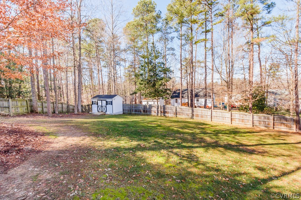 2612 Iverson Road Midlothian, VA 23112 - Photo 21 of 23 a swimming pool with trees in the background