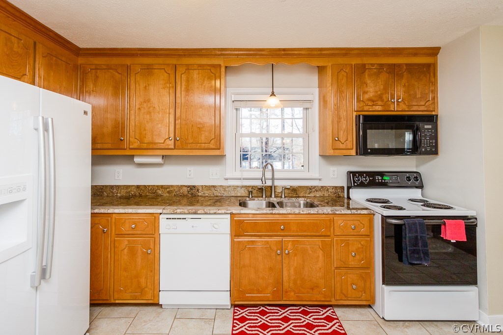 2612 Iverson Road Midlothian, VA 23112 - Photo 6 of 23 a kitchen with a stove a sink and a microwave