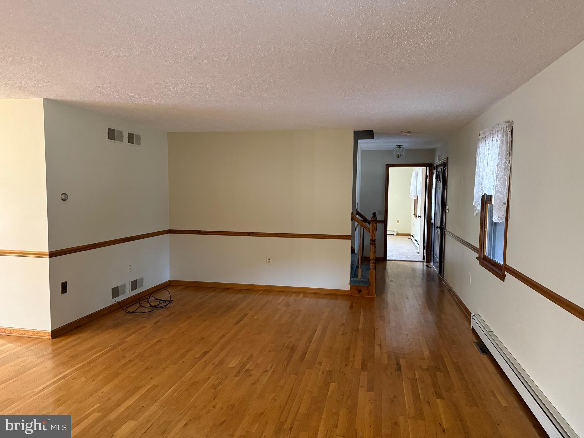 992 Silver Lane Berkeley Springs, WV 25411 - Photo 11 of 44 a view of a room with wooden floor