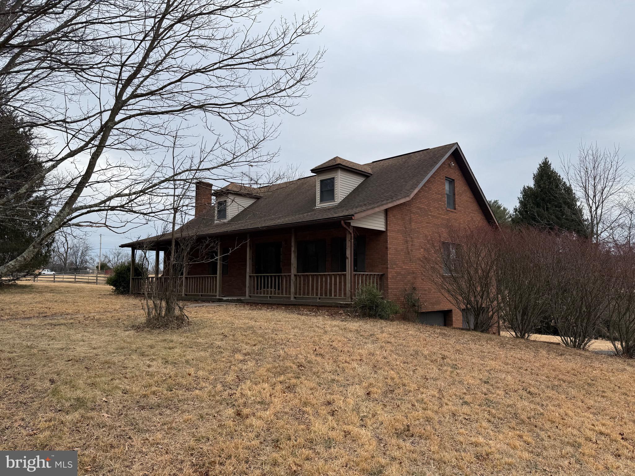 992 Silver Lane Berkeley Springs, WV 25411 - Photo 2 of 44 a front view of a house with a yard