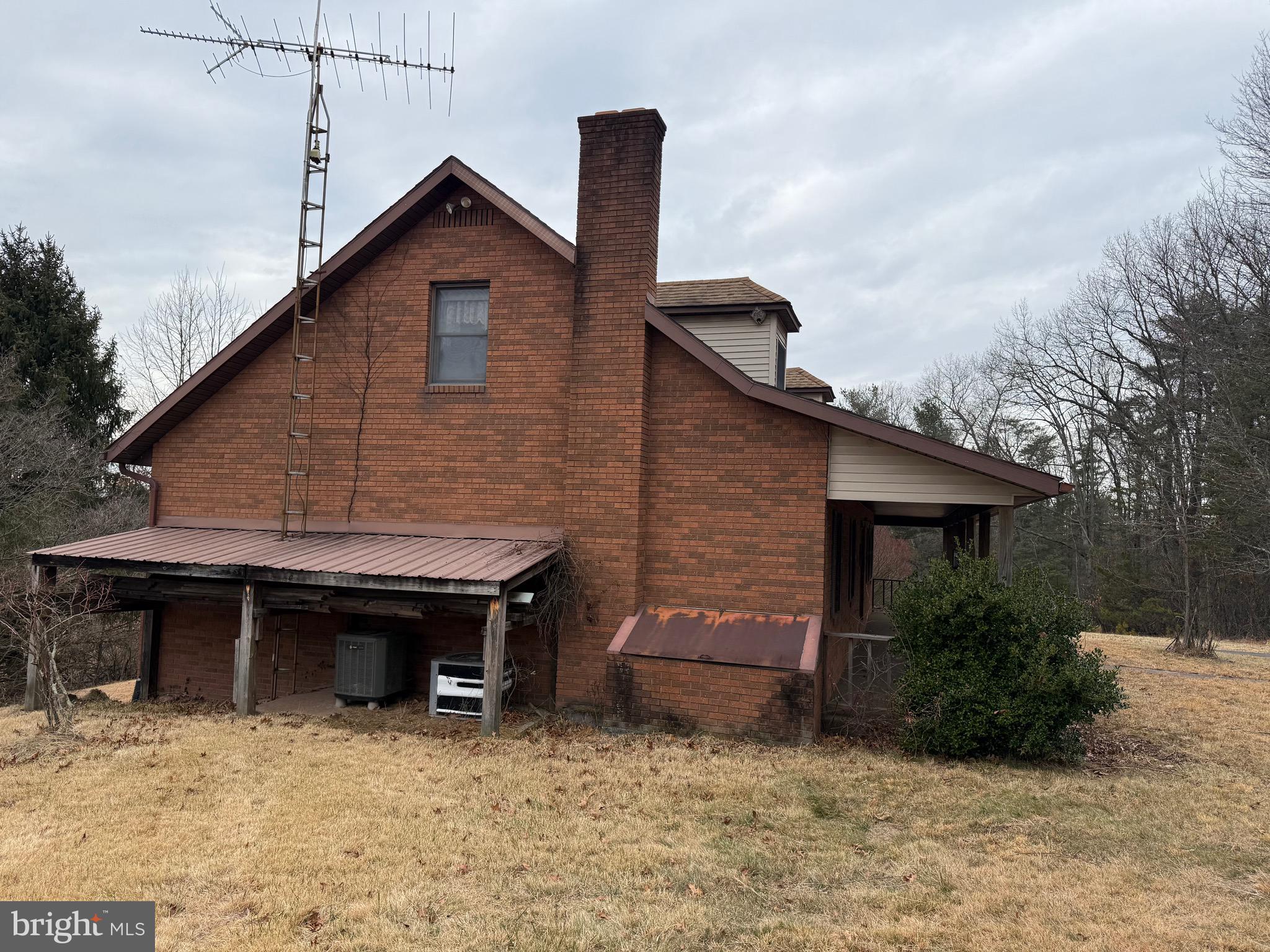 992 Silver Lane Berkeley Springs, WV 25411 - Photo 34 of 44 a front view of a house with garden