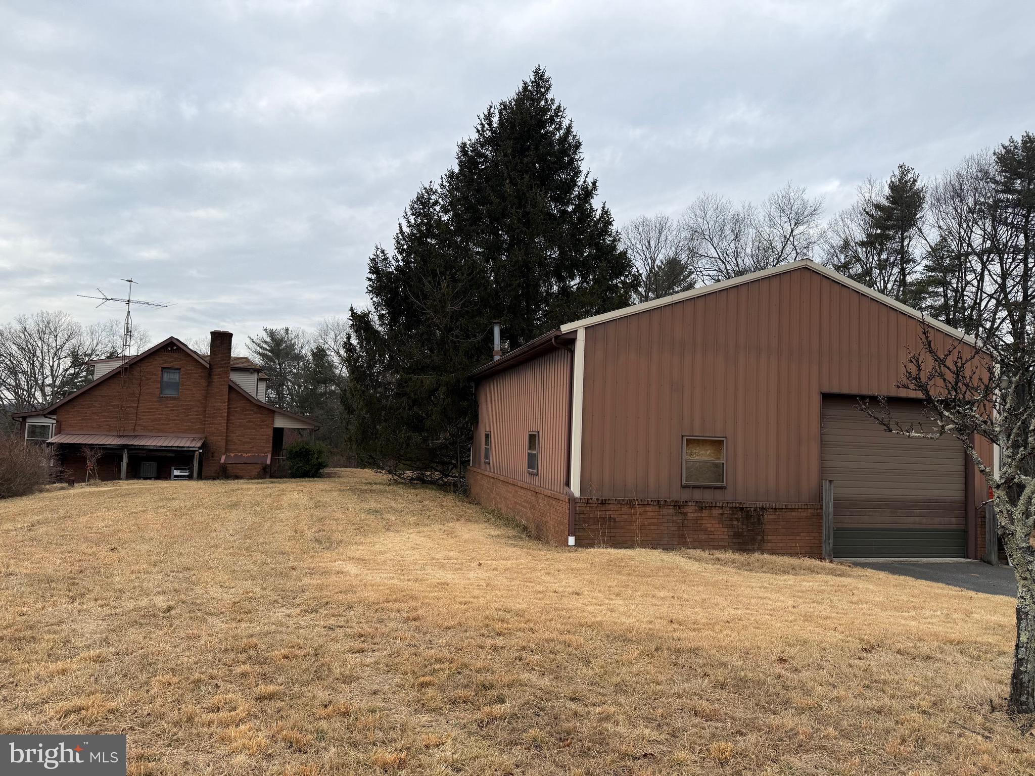 992 Silver Lane Berkeley Springs, WV 25411 - Photo 42 of 44 a view of a house with a yard and garage