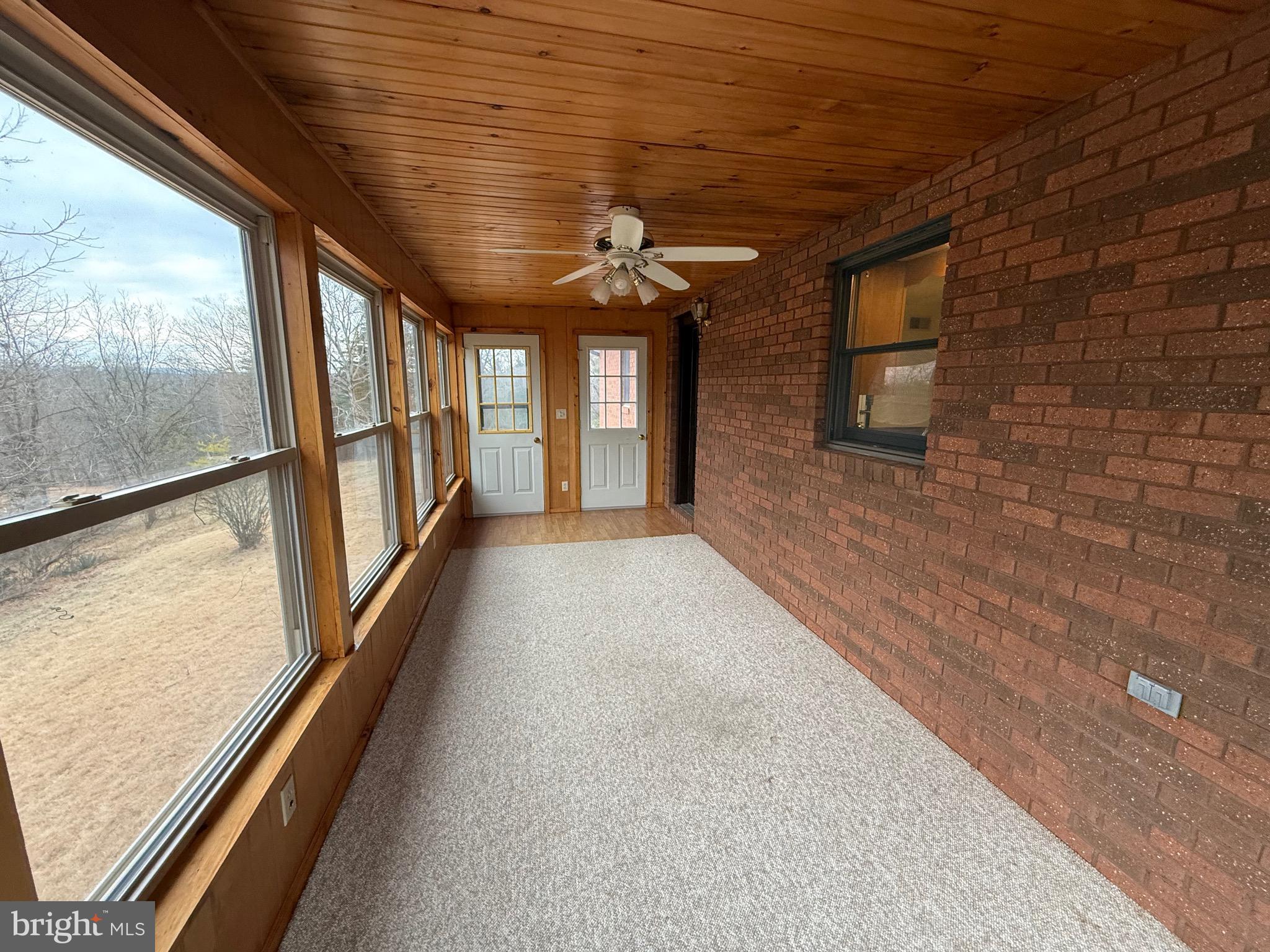 992 Silver Lane Berkeley Springs, WV 25411 - Photo 6 of 44 a view of hallway with a large window